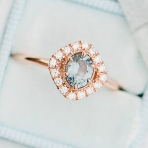 an-engagment-ring-sits-in-a-blue-box (10)